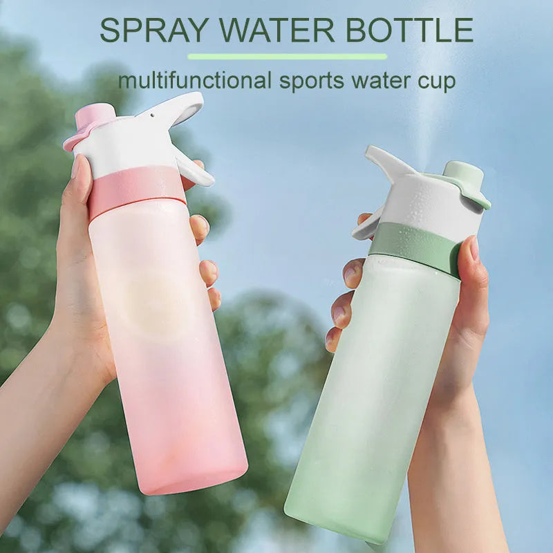 White 700ml plastic spray water bottle with handle strap and leakproof lid.