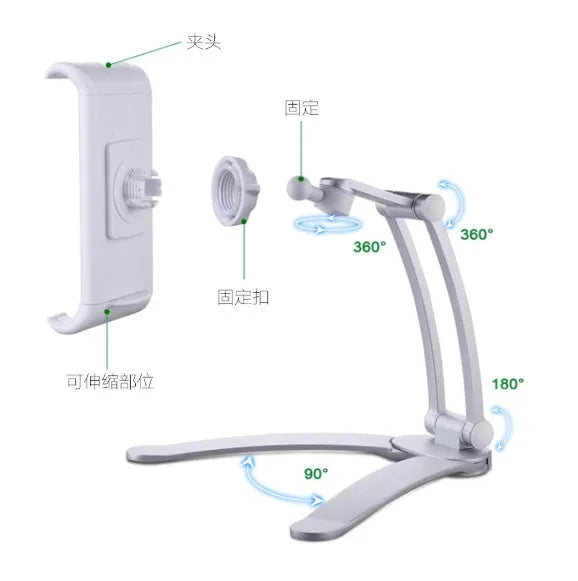 Silver aluminium alloy tablet stand with adjustable black clips holding a tablet, showing 360-degree rotation on a wooden desk.