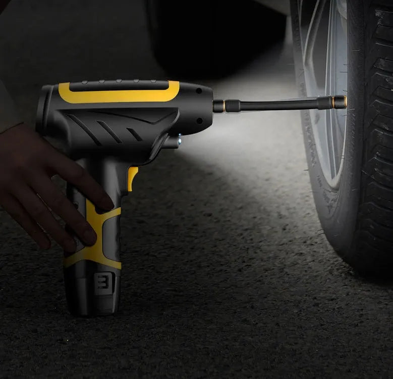 Wireless handheld air pump in black with LED light and pressure gauge, inflating a car tyre