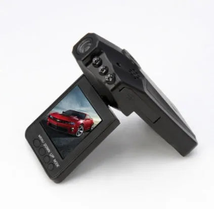 H198 car dash cam on a dashboard showing its 2.4-inch screen and infrared LEDs for night vision.