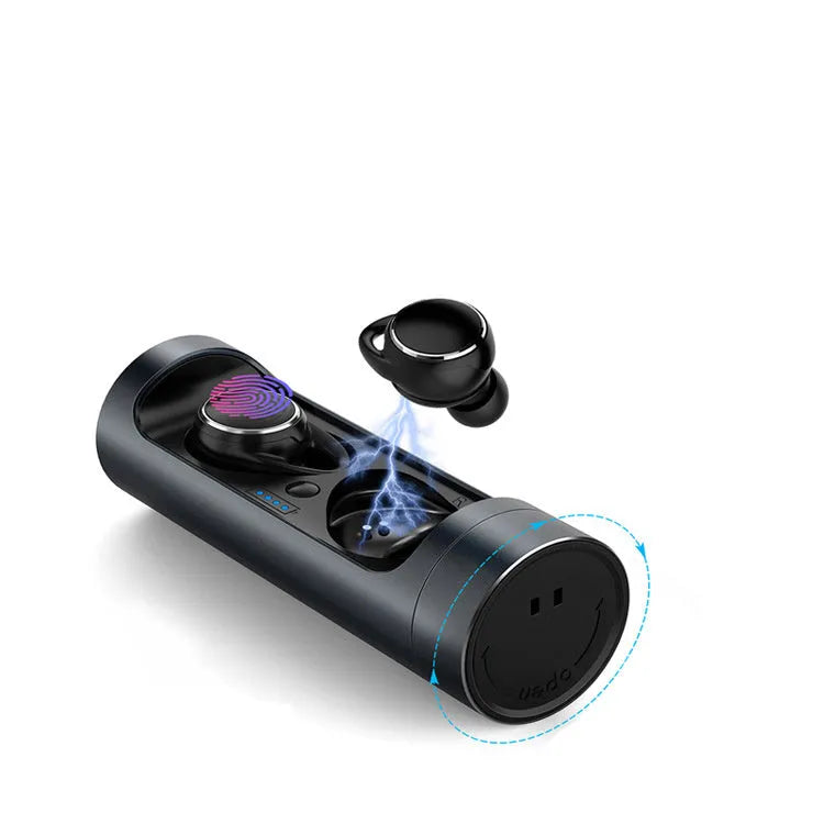 Dark Grey wireless Bluetooth headset with charging bay on a table.
