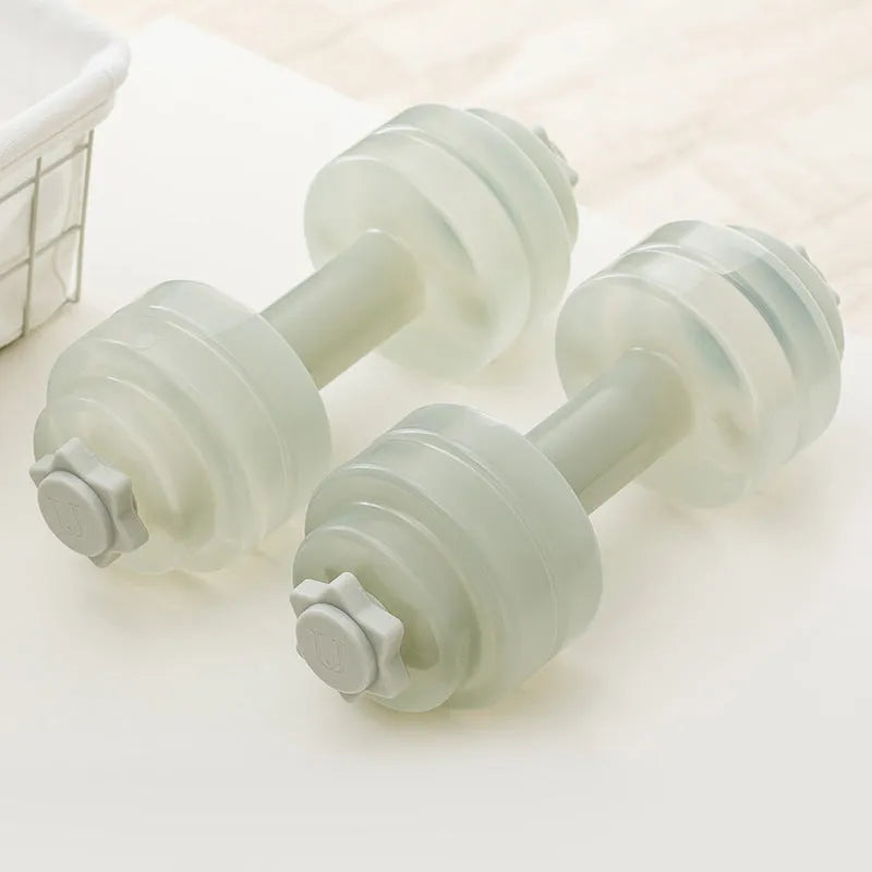 Mini portable plastic water dumbbell in transparent grey on flat surface with water filling opening visible