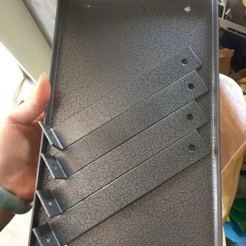 Black iron flip chip bracket stand for a small electric hand planer.