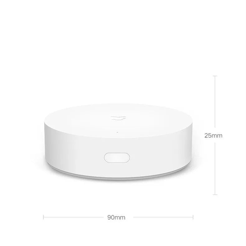 White circular intelligent multimode gateway for smart home remote control, 90mm diameter with UK plug.