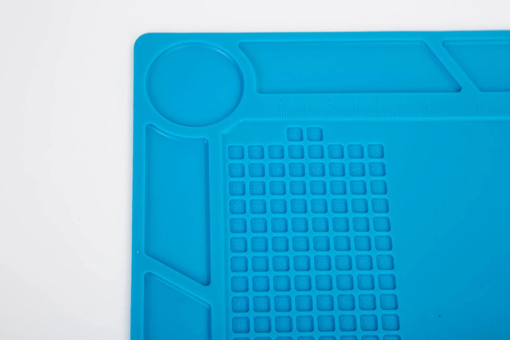 Blue silicone watch repair table mat with smooth non-slip surface for organising small components