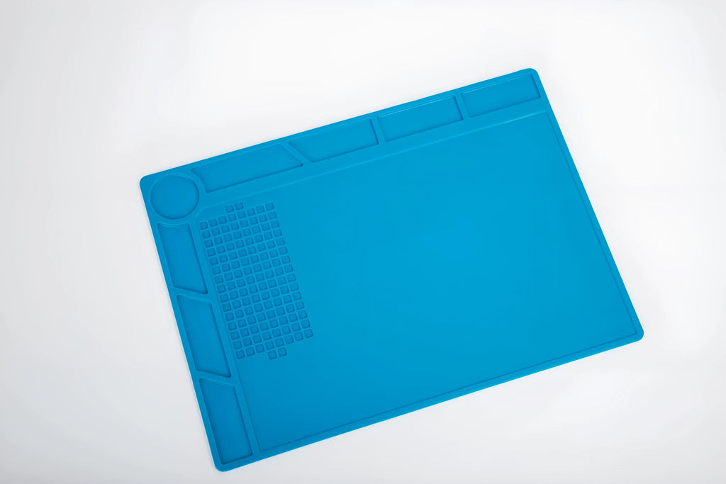 Blue silicone watch repair table mat with smooth non-slip surface for organising small components