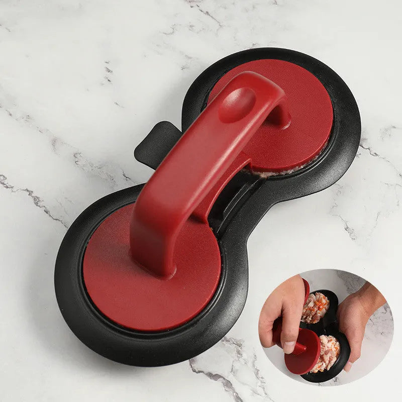 Black and red burger press mould with oil paper liners for making patties