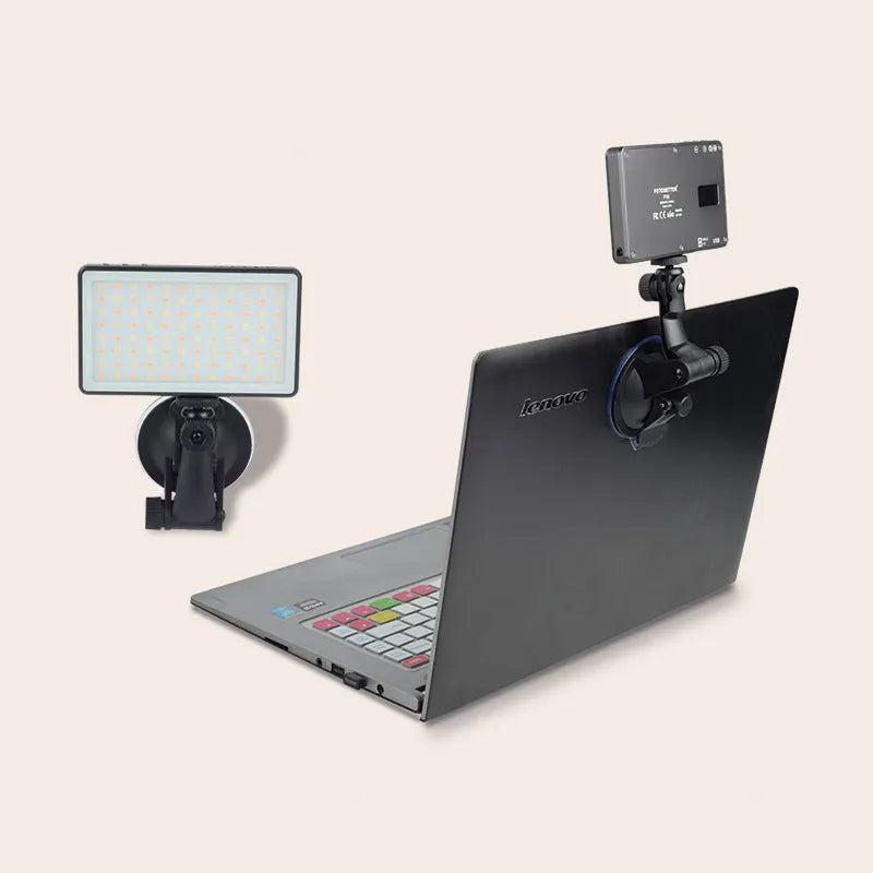 Black aluminium LED panel light for laptop video conferencing with USB-C port and LCD screen.