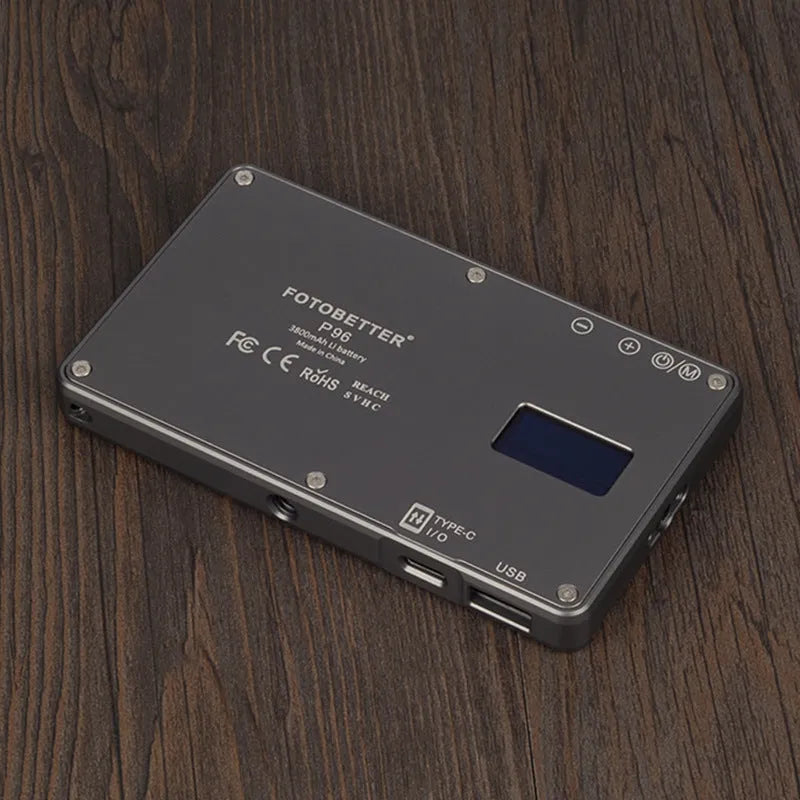 Black aluminium LED panel light for laptop video conferencing with USB-C port and LCD screen.