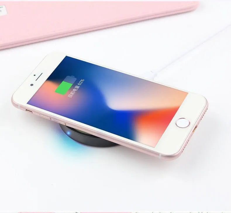 A compact square wireless charger base in one of six colours: black, blue, orange, red, white, or yellow.
