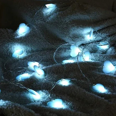 Battery-operated LED fairy string lights in pink or purple colours with 3 metre cable length for bedroom decoration