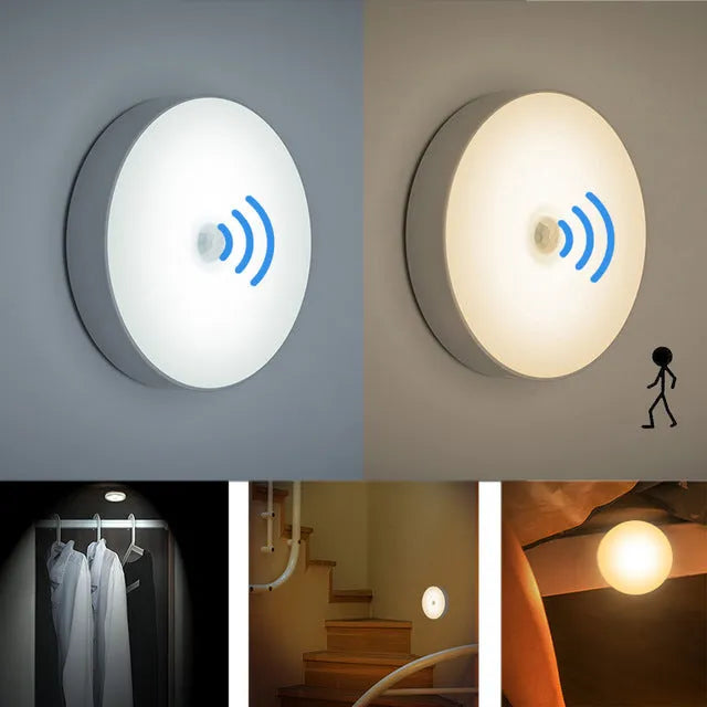 Small white circular LED body sensing night light with USB charging cable and adhesive tape.