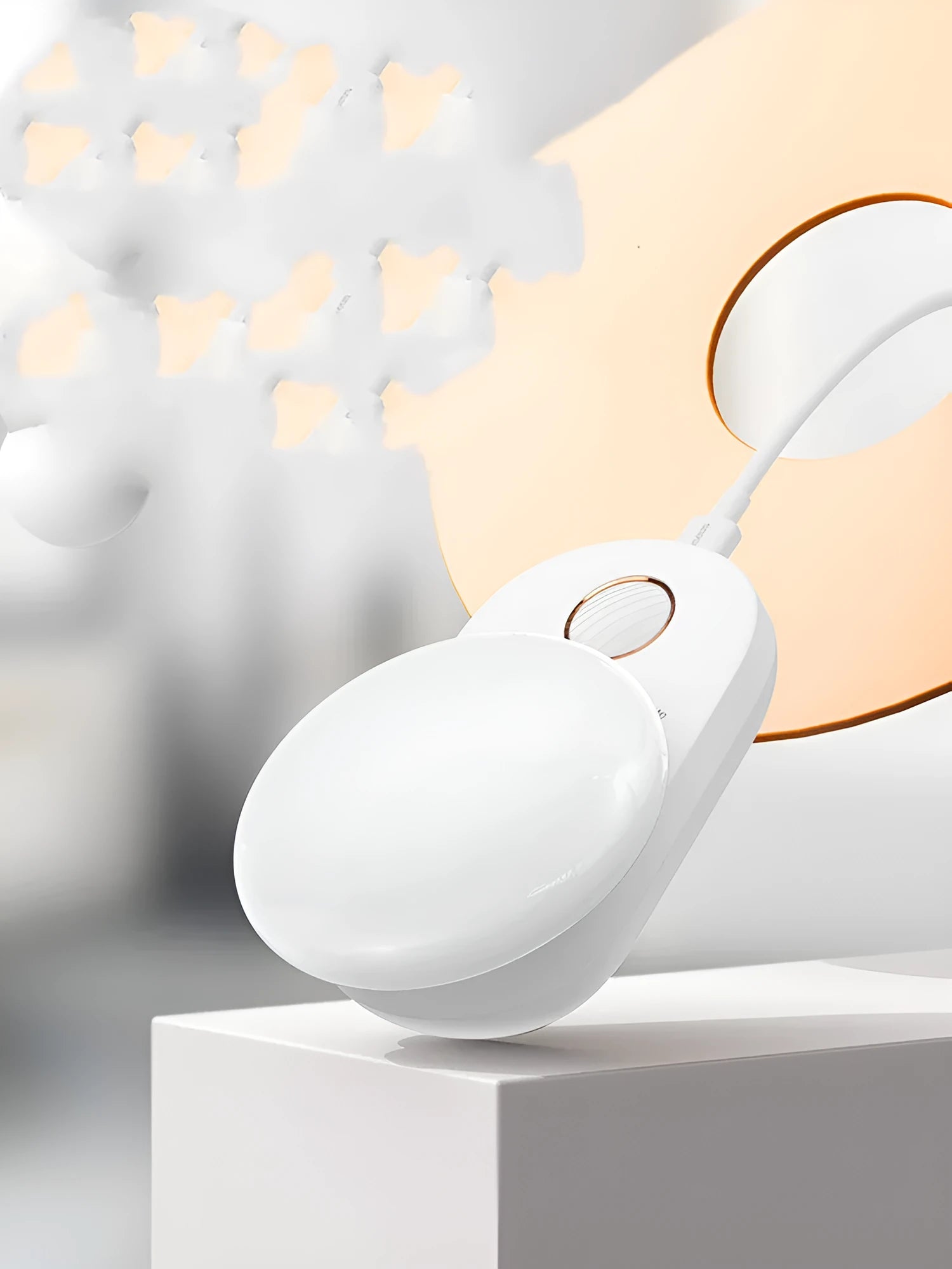 White Baseus rechargeable motion sensor night light on a bedside table