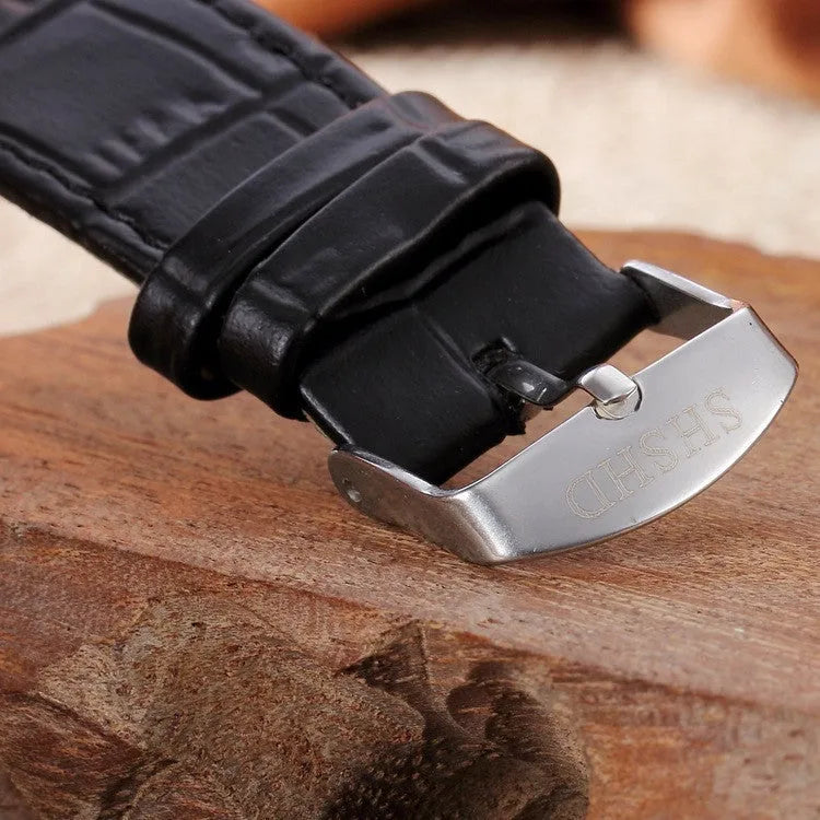 Neutral casual quartz watch with round 38mm dial, black strap, and alloy case on a plain background