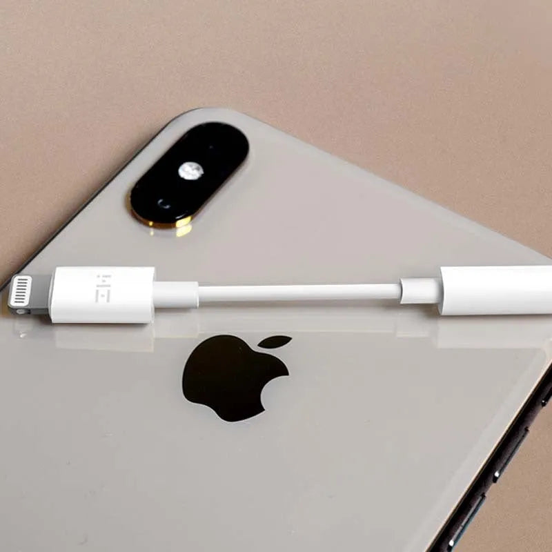 White Lightning to 3.5mm audio adapter cable for iPhone compatibility with charging port