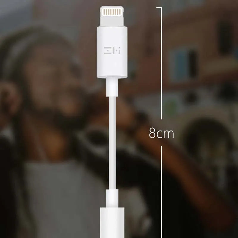 White Lightning to 3.5mm audio adapter cable for iPhone compatibility with charging port