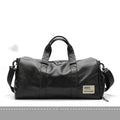 Black PU leather sports training bag with external handles, shoulder strap, and multiple internal organisational pockets.