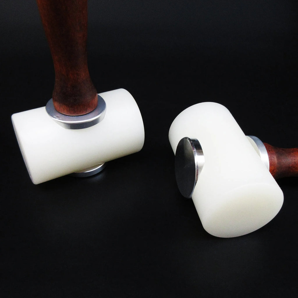 Brown handled T-shaped leather carving hammer with white nylon head for stamping and engraving