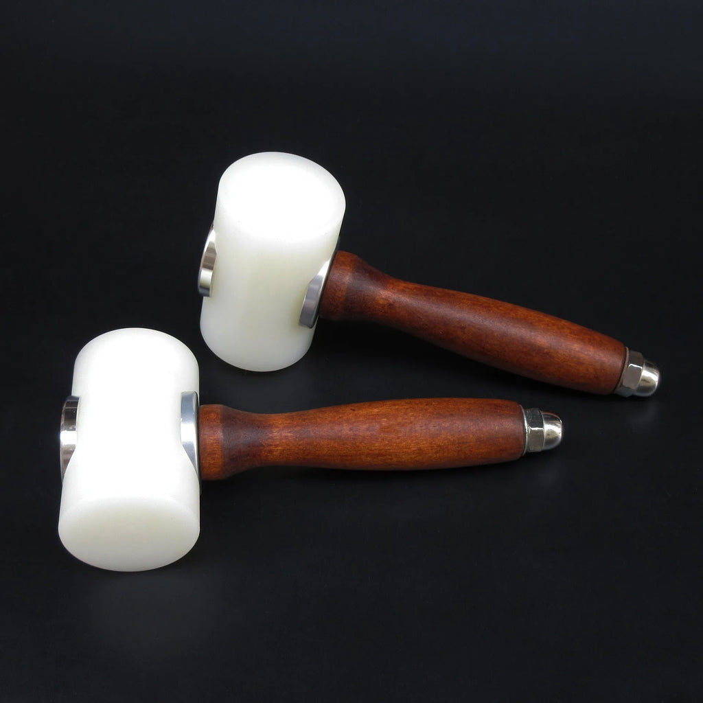 Brown handled T-shaped leather carving hammer with white nylon head for stamping and engraving
