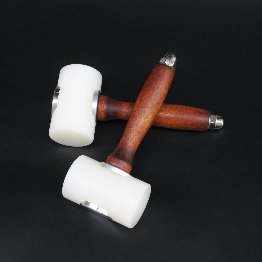 Brown handled T-shaped leather carving hammer with white nylon head for stamping and engraving