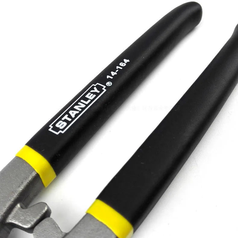 Yellow-handled high carbon steel barbed wire shears on a workbench