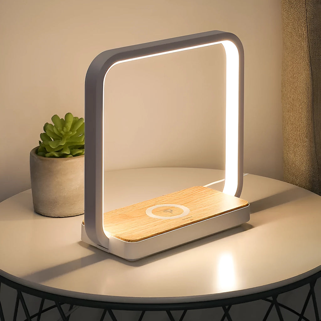 Modern smart bedside lamp with touch base and aluminium shade in white or gold, showing USB cable.