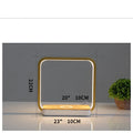 Modern white smart bedside lamp with voice control and USB cable on a wooden nightstand.