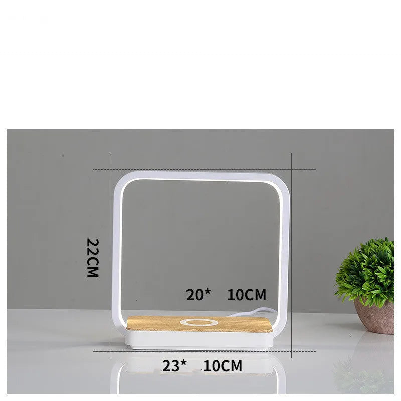 Modern smart bedside lamp with touch base and aluminium shade in white or gold, showing USB cable.