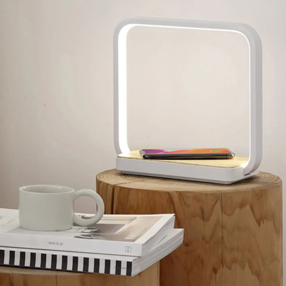 Modern smart bedside lamp with touch base and aluminium shade in white or gold, showing USB cable.