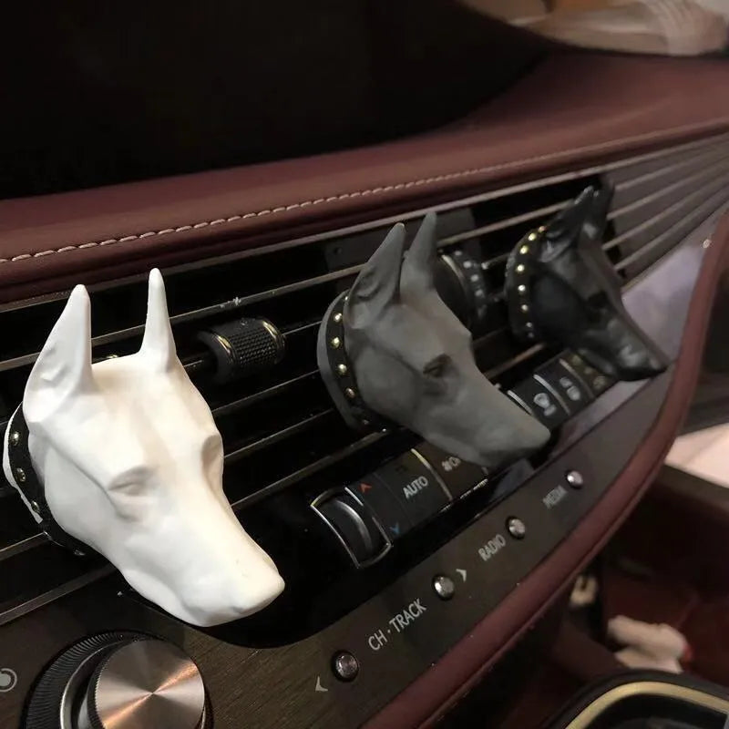 Doberman-shaped car air vent aromatherapy diffuser stone in black colour with clip attachment on car dashboard