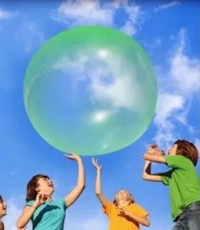 Assortment of inflated pink, yellow, blue and green TPR bouncy balls in different sizes on a plain background.