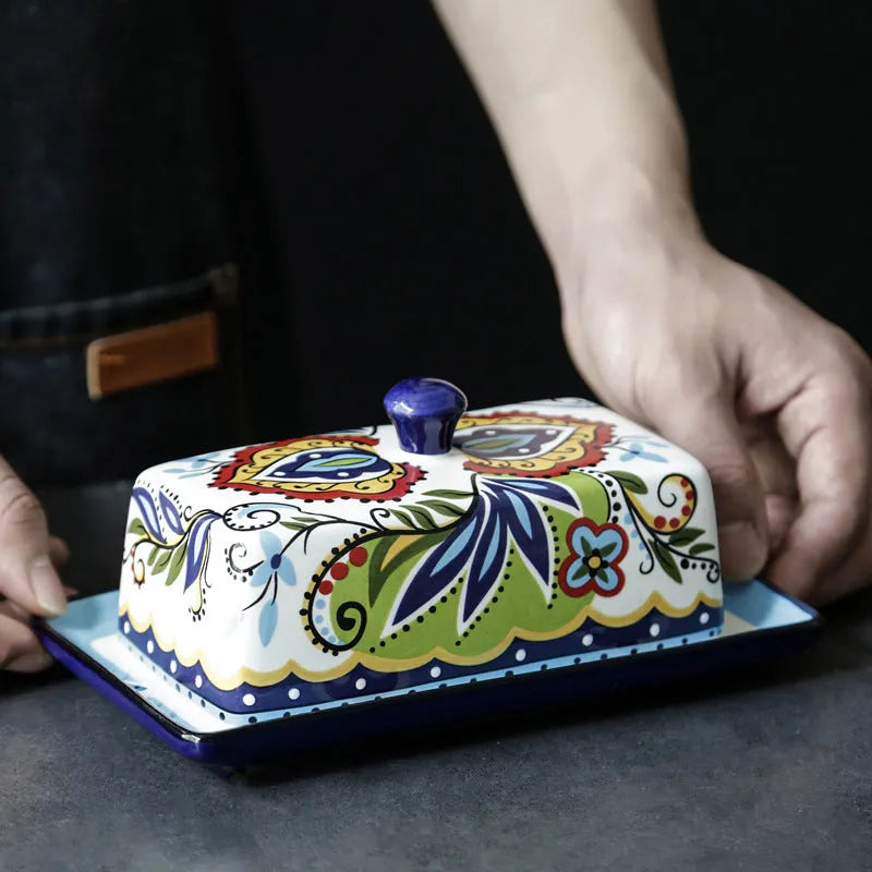 Square ceramic butter box with lid showing floral pattern, suitable for cutlery storage