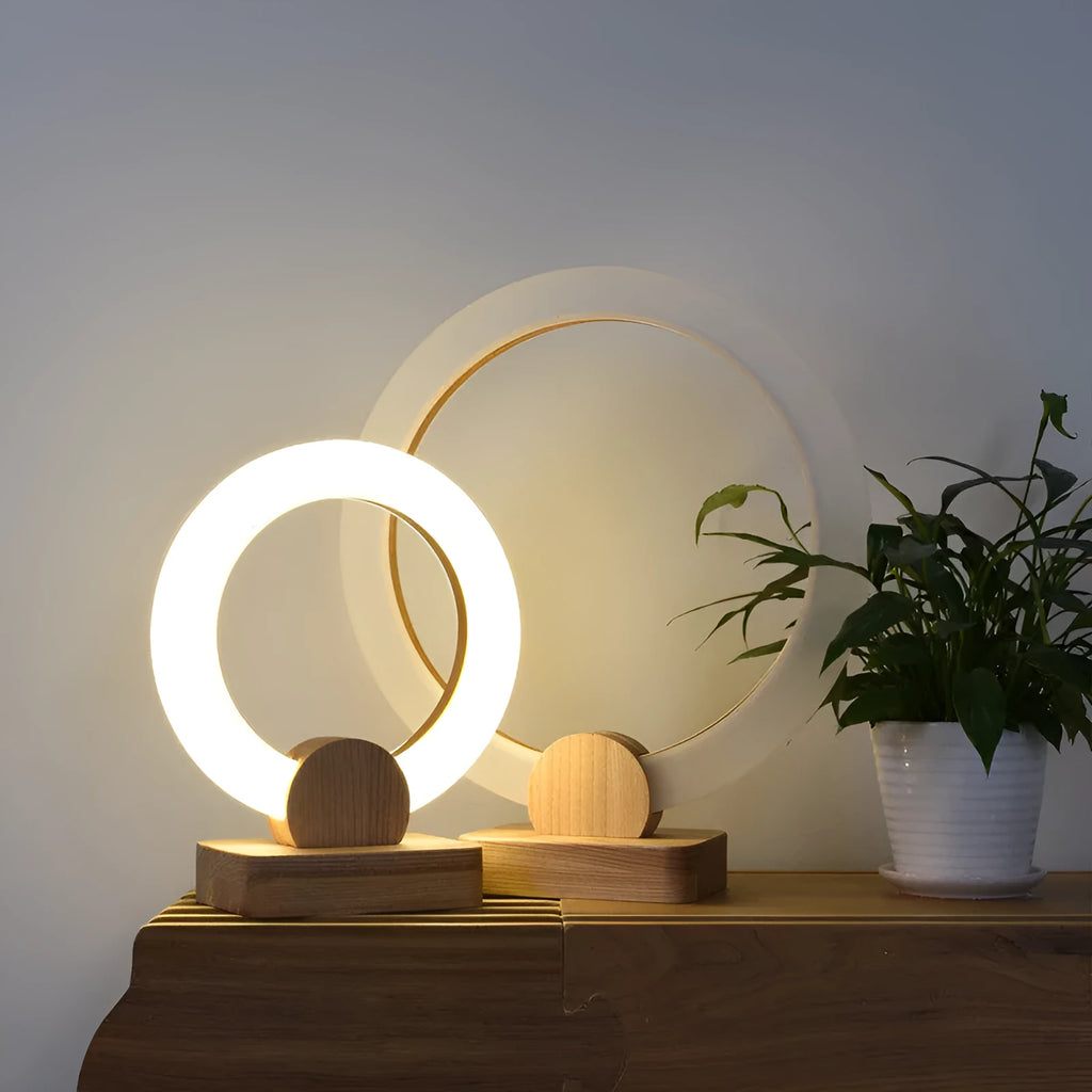 Nordic style wooden circular chandelier with acrylic shade in a living room setting.