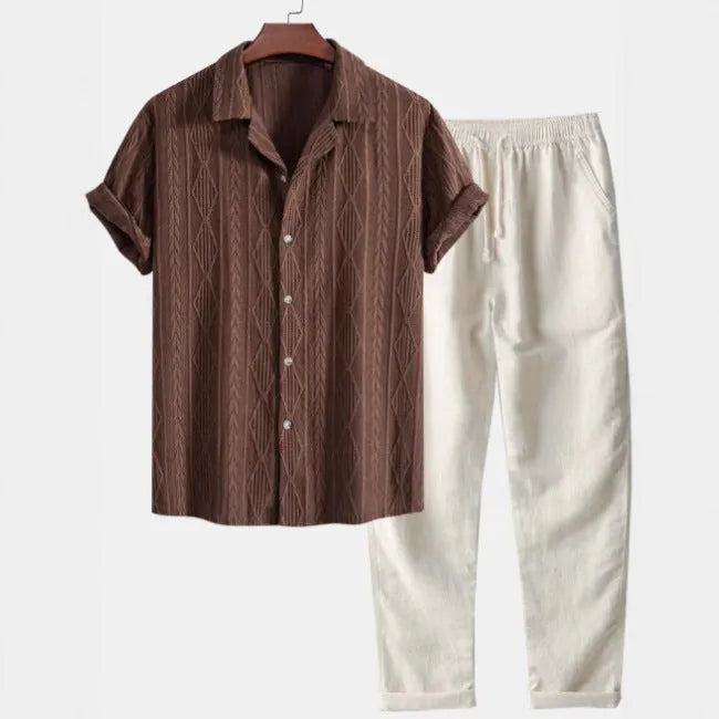 Man wearing a slim fit camouflage print short sleeve shirt and matching trousers casual suit