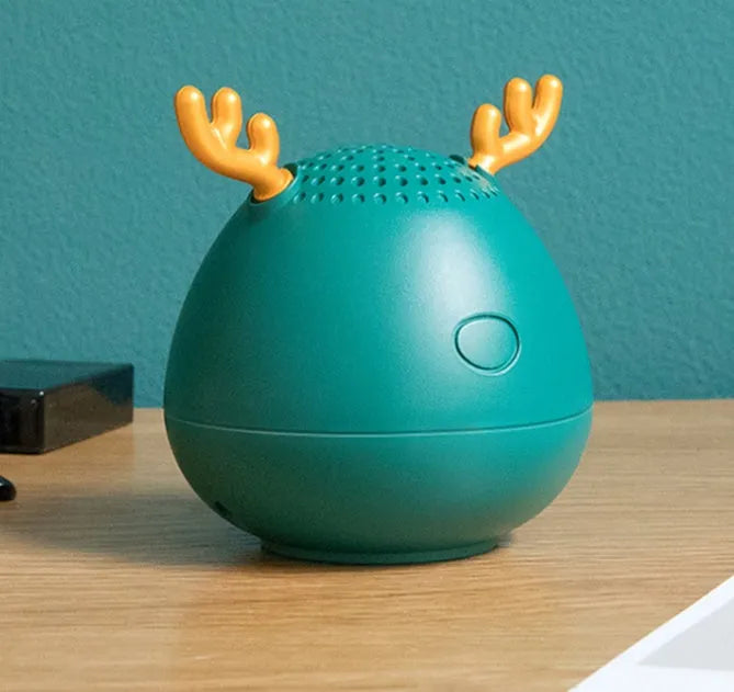 Compact Bluetooth speaker in white, pink or green colour measuring 75x88mm with USB charging port