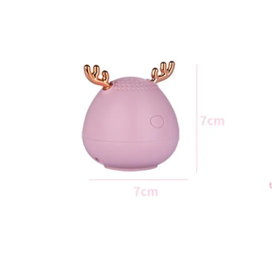 Compact Bluetooth speaker in white, pink or green colour measuring 75x88mm with USB charging port