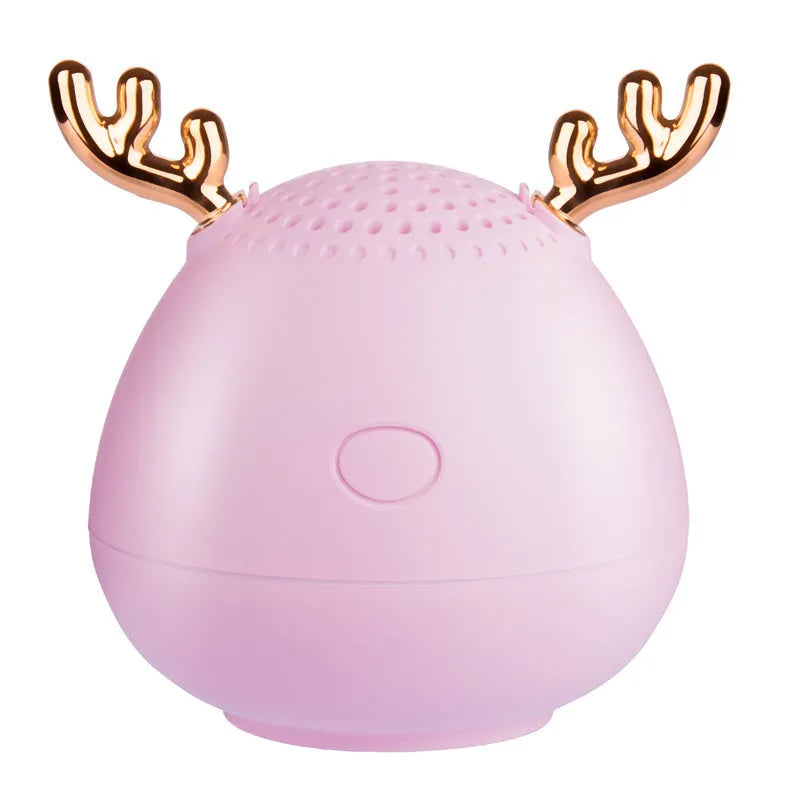 Compact Bluetooth speaker in white, pink or green colour measuring 75x88mm with USB charging port
