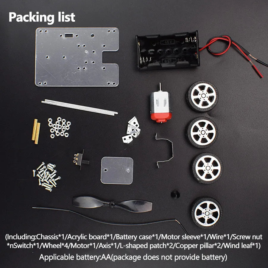 Assembled DIY wind car science experiment kit with acrylic, metal, and plastic parts on a table.