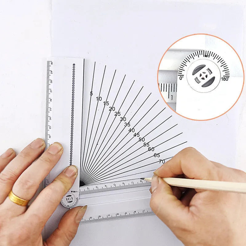 White plastic multi-function ruler measuring 30cm in length on a drawing surface.