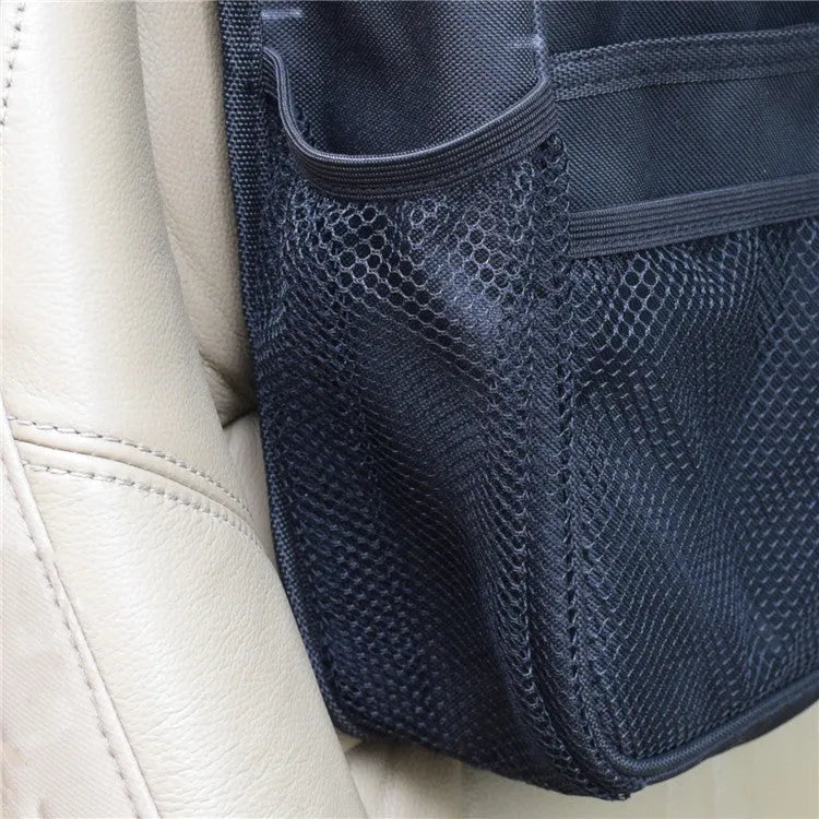 Black polyester car suspension storage bag measuring 35 by 28 by 9 centimetres, hung on a car seat back