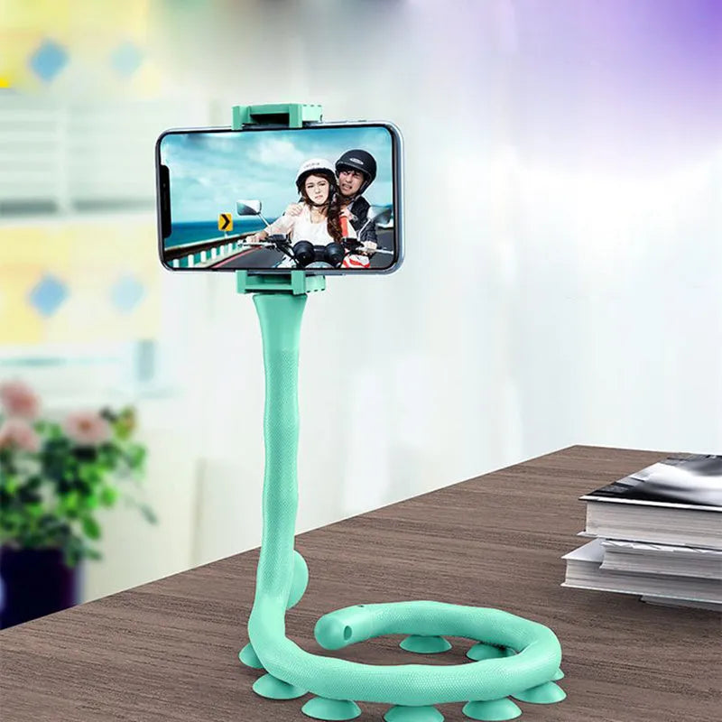Black flexible rubber phone holder with suction cup bent into shape showing 62cm length