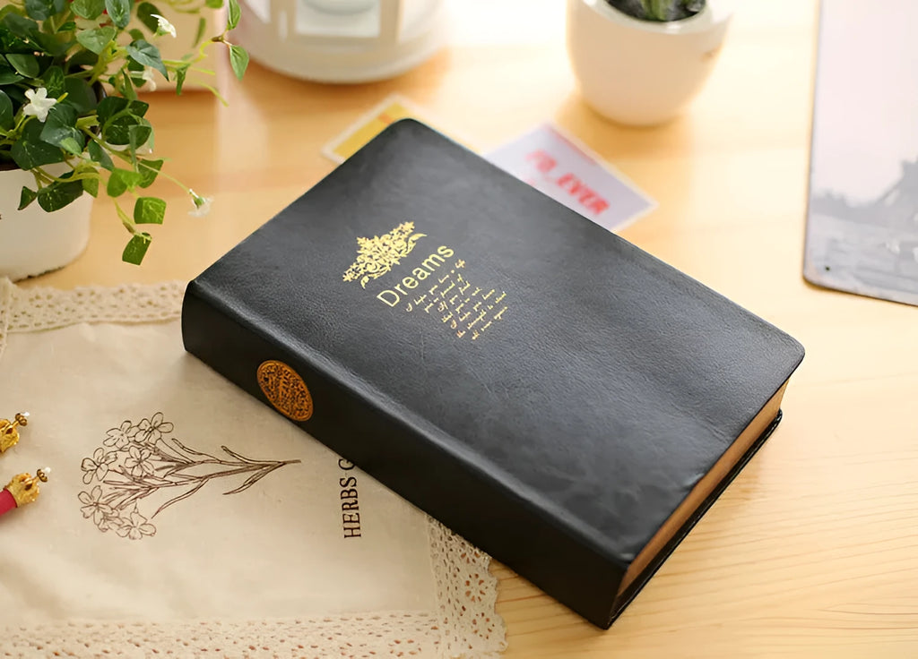 Jingu 25k thick imitation leather notebook open on a desk