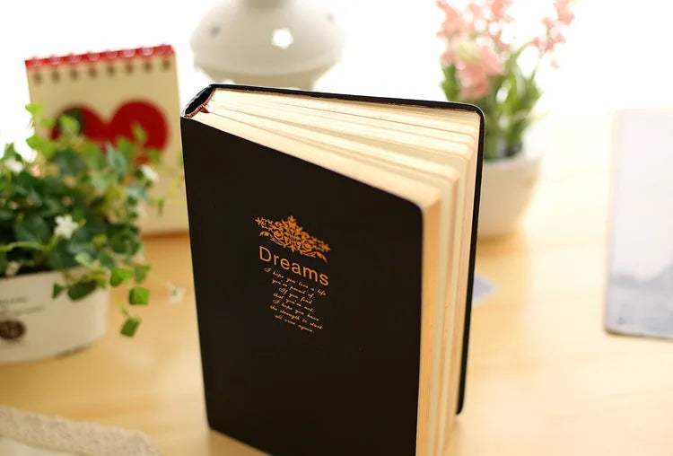 Jingu 25k thick imitation leather notebook open on a desk