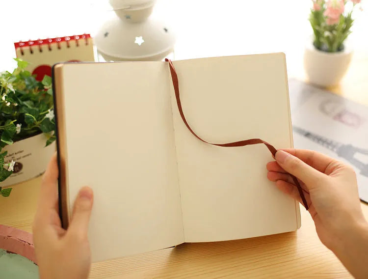 Jingu 25k thick imitation leather notebook open on a desk