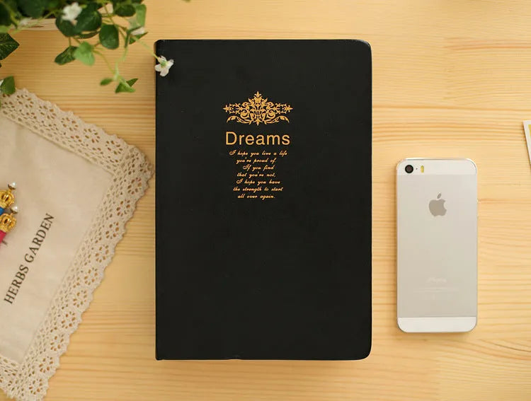Jingu 25k thick imitation leather notebook open on a desk
