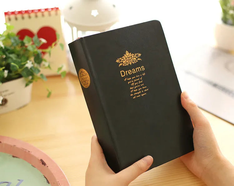 Jingu 25k thick imitation leather notebook open on a desk