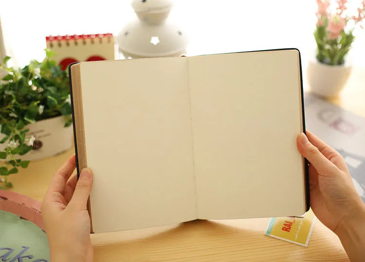Jingu 25k thick imitation leather notebook open on a desk
