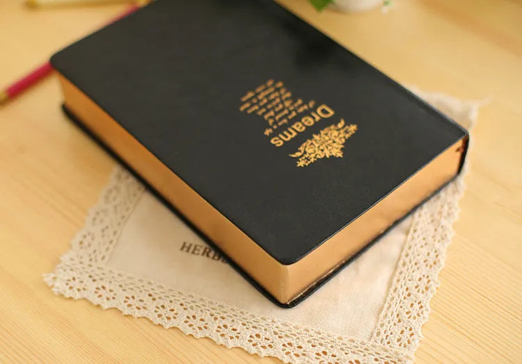 Jingu 25k thick imitation leather notebook open on a desk