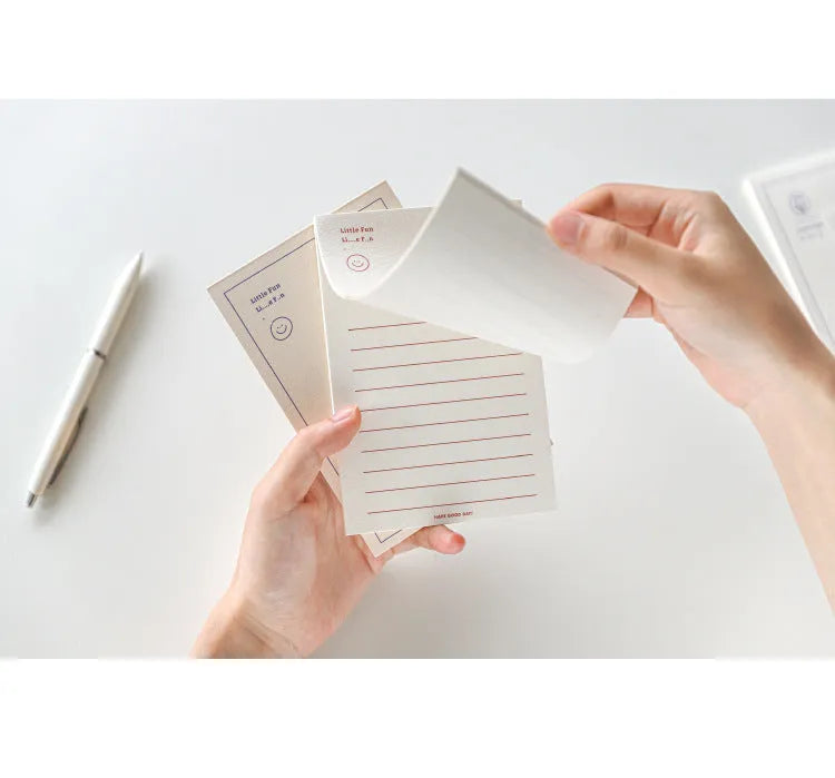 Rectangular memo pad notebook with paper cover compatible with Apple iPhone, showing blue tulip design
