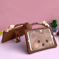 Brown cartoon-style silicone sleeve case for iPad with an integrated folding bracket stand.
